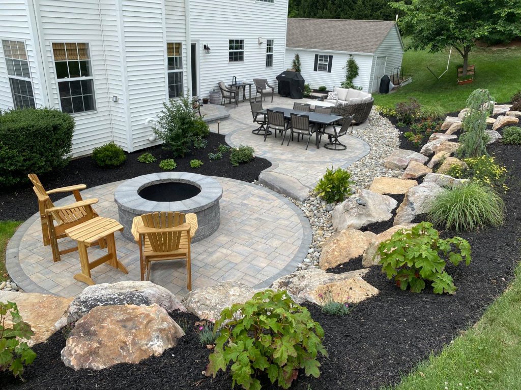 After image of home backyard before work with thick and dry grass.