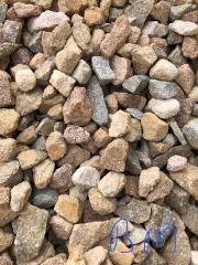 primarily tan but other color stones in a pile called Blue Mountain Stone.